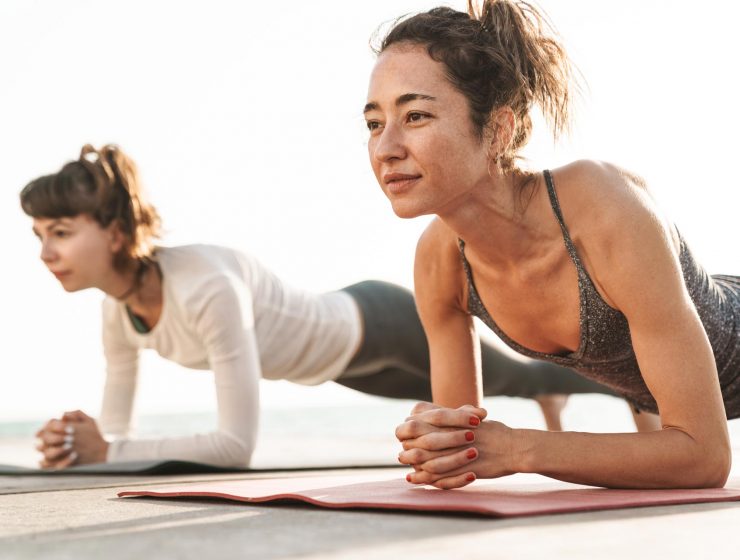 photo-of-focused-young-women-doing-exercises-on-ma-XKYPDWG.jpg